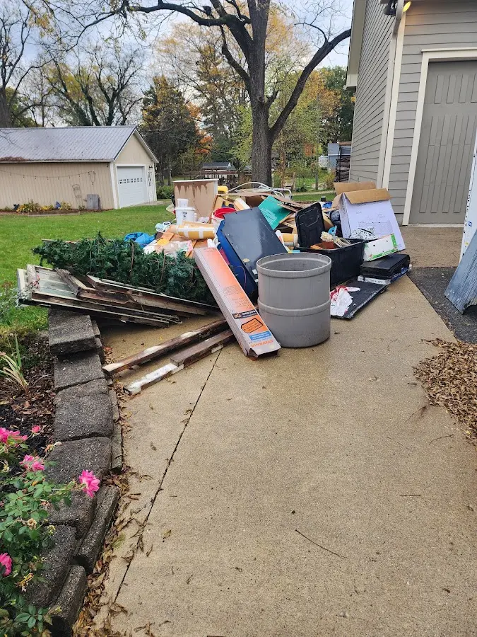 Dumpster being loaded with debris for 30 Yard Dumpster Rental in Blacklick Estates
